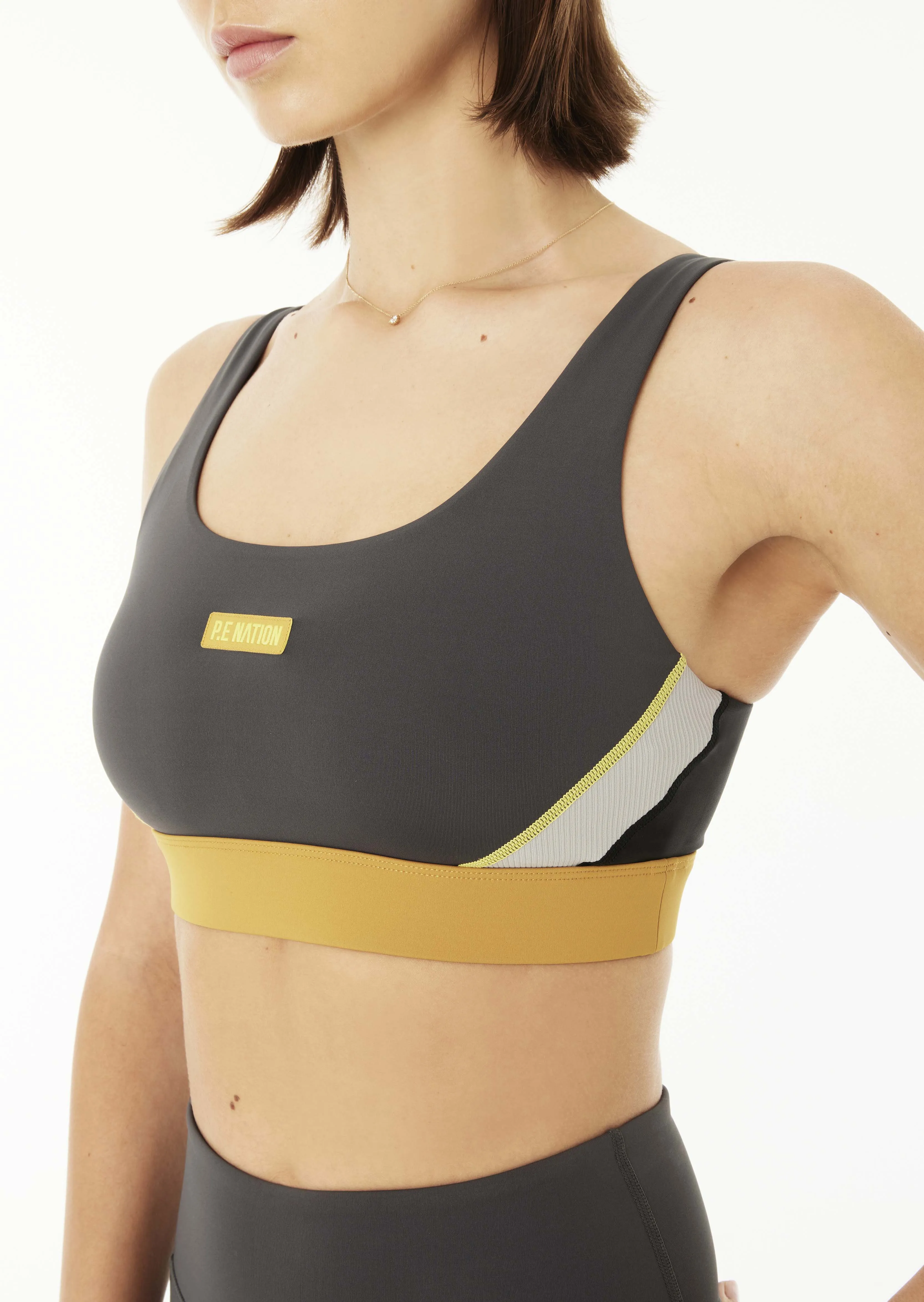 RIOCHET SPORTS BRA IN DARK SHADOW